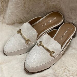 White slip ons with gold hardware
